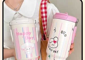Detail of high-capacity stainless steel tumbler with Happy Day print and carry handle