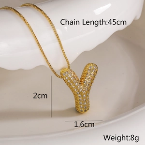 Detail of gold letter Y necklace with white crystals including size and weight specs