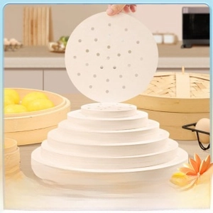 Macro detail of food-grade non-stick round steaming paper with multiple size options
