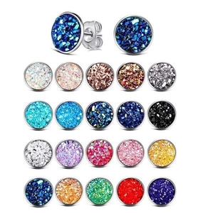 Macro detail of 20 pairs of 12mm titanium steel stud earrings in various glitter colors