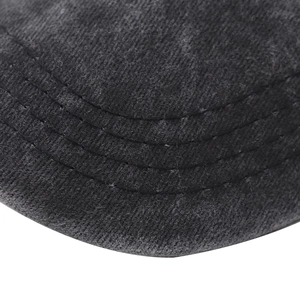 Macro shot of washed cotton baseball cap brim with durable triple stitching detail