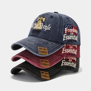 Detailed embroidery of We the People and 1776 on vintage washed cotton baseball caps