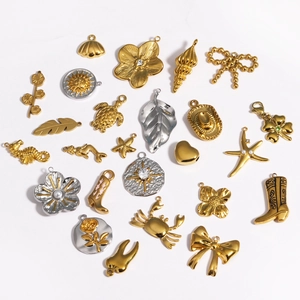 Golden and silver stainless steel pendants set with sea creatures and bow designs