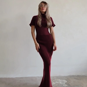 Detail of dark red high-neck mesh patchwork dress in ribbed knit fabric worn by model