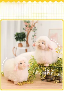 Detailed view of two cute plush sheep dolls with soft white faux fur on a wooden table