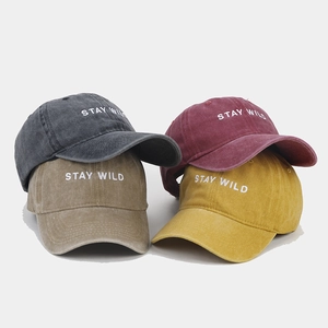 Washed cotton baseball caps in four colors featuring STAY WILD embroidery for men and women