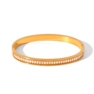 Detailed macro view of 18K gold-plated stainless steel bangle with inlaid zircons