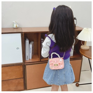 Pink silicone crossbody bag for girls with pearl handle and metal chain strap details
