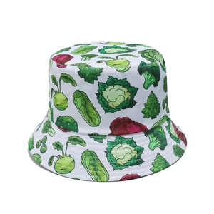 Detailed view of bucket hat with vibrant green broccoli and vegetable print pattern