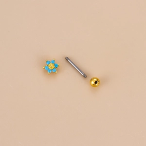 Macro detail of Bohemian blue stone cartilage stud showing threaded assembly structure