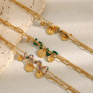 Detail of 18K gold-plated double-layer chain bracelet with colorful beads and coin pendant