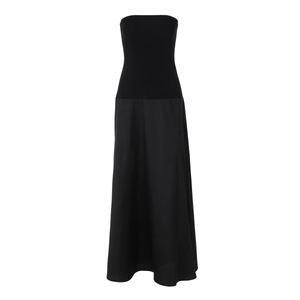 Close-up of a black strapless dress featuring a knit bodice and woven skirt stitching