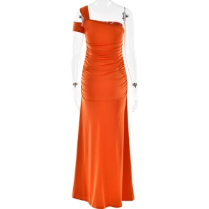 Detail of the elegant orange one-shoulder maxi dress with side slit and waist ruching