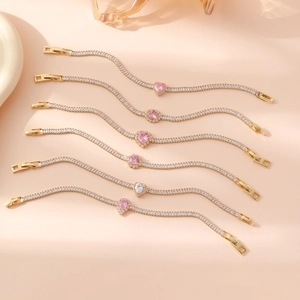 Elegant gold plated tennis bracelets featuring pink heart zircons and sparkling diamonds