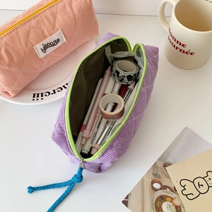 Large capacity checkered pencil case in purple and pink orange with zipper closure