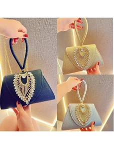 Elegant rhinestone evening bag with sparkling tassels in black, gold, and silver finishes