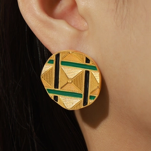 Golden round pyramid engraved earrings with green and black enamel geometric design