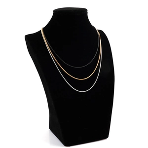 Minimalist stainless steel snake chain necklace set in black, gold, and silver finishes