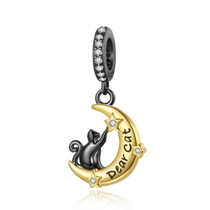 Detailed close-up of S925 sterling silver cat and moon charm with sparkling crystals