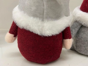 Detail shot of the felt texture and white faux fur trim on the back of Christmas gnomes