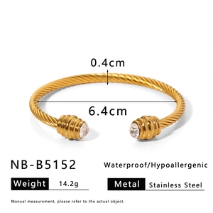 Detail showing gold twisted stainless steel cuff bracelet with 6.4cm inner diameter size