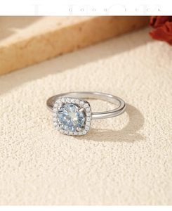 Detailed close-up of a square halo moissanite ring with a brilliant round center stone