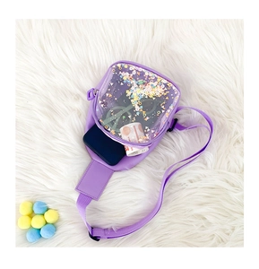 Detail of purple transparent PVC chest bag for kids with colorful glitter sequins and strap
