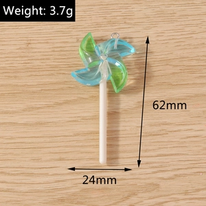 Detailed view of teal windmill resin pendant with 62mm height and 3.7g weight specs