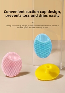 Close-up of soft silicone baby hair brushes with dense bristles and suction cup handle
