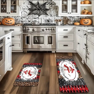 Detail of 2-piece Christmas kitchen mat set with snowman print and buffalo plaid texture