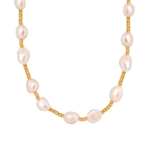 French style natural freshwater pearl and gold bead spliced necklace on white backdrop