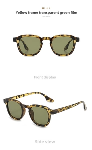 Detail view of round vintage sunglasses with yellow tortoise frames and transparent green lenses