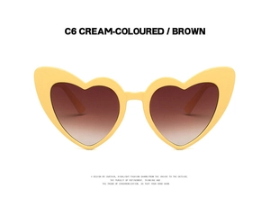 Detail of cream-colored heart-shaped sunglasses featuring brown gradient UV400 lenses