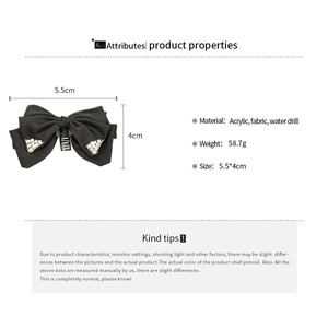 Detailed view of black fabric bow hair claw clip with rhinestones and product dimensions