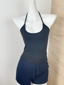 Front view of black halter top and navy drawstring shorts set on white mannequin