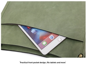 Macro detail of grass green tote bag showing spacious front pocket for tablet storage