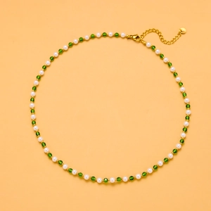 Elegant natural pearl necklace with green faceted beads and golden lobster clasp closure