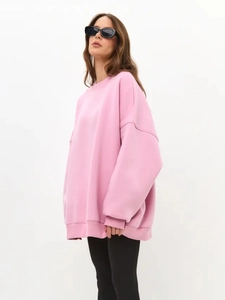 Detail of pink oversized sweatshirt with thick fleece lining for autumn winter style