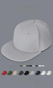 Detail view of various breathable hip hop flat brim caps with laser-cut ventilation holes