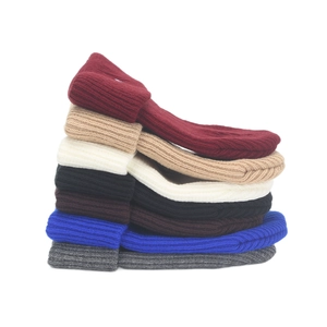 Winter ribbed knit beanies in multiple colors shown stacked on a white background