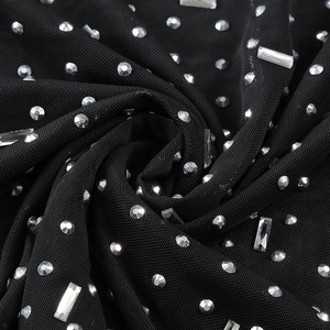 Detail of black mesh fabric with silver rhinestones and sequins on this luxury dress