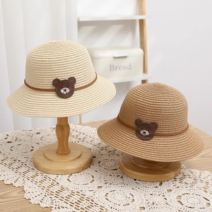 Kids raccoon straw sun hats in beige and tan featuring cute bear embroidery patches