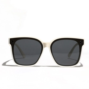 Trendy cream polarized sunglasses with black lenses and vintage three-dot frame details