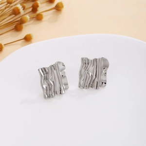 Silver textured rectangular stud earrings with modern irregular water ripple pattern