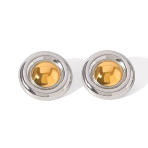 Detailed view of minimalist two-tone 18K gold and silver round stainless steel stud earrings