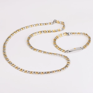 Detailed view of gold and silver cuban chain set with a polished engravable ID plate