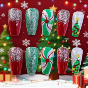 Christmas press-on nails with red green glitter and hand-painted festive tree designs