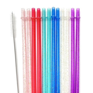 Reusable glitter plastic straws in various colors with a dedicated cleaning brush