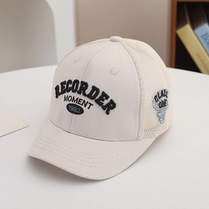 Detail of breathable mesh and high-quality 3D embroidery on the beige baseball cap