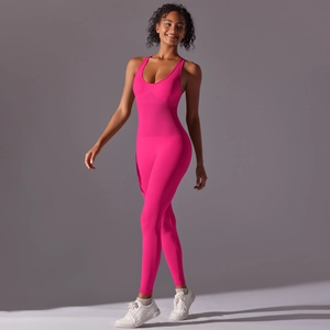 Macro detail of the bright rose pink one-piece yoga jumpsuit with seamless slimming design